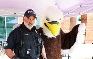 Officer with Eagle Mascot Officer with Eagle Mascot