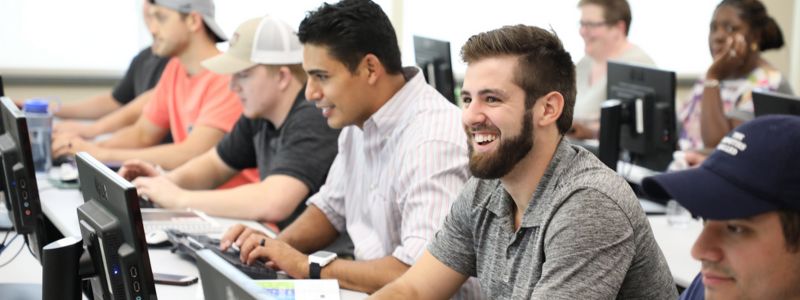 Male Students Typing on Computers Male Students Typing on Computers