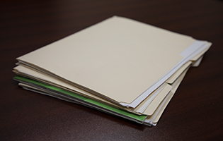 Stack of folders with papers in them Stack of folders with papers in them