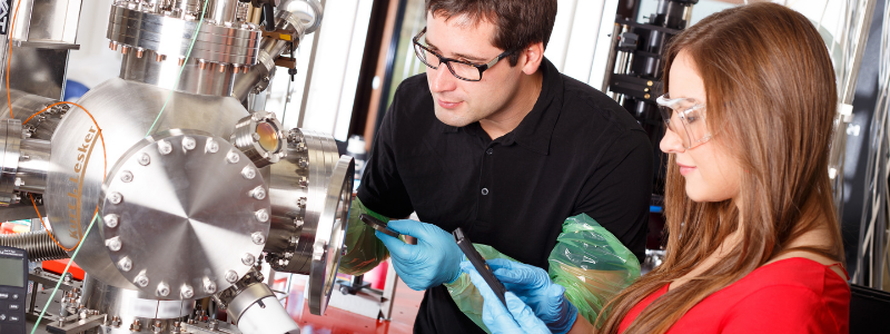 Woman and Man Working with Tools and Machinery Woman and Man Working with Tools and Machinery