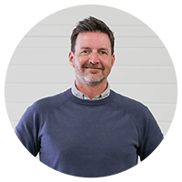 Dave Olson of 单车业雇主协会 Man in blue sweater smiling