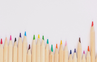 colored pencils on white surface