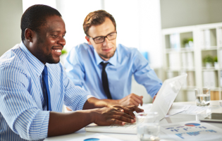 two men working on a computer