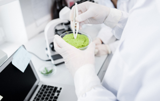 scientist studying substance in a lab