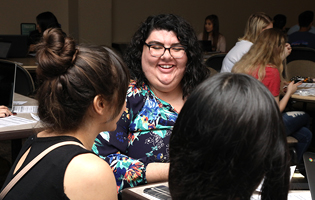 A Group of Women Sitting at a Table A Group of Women Sitting at a Table