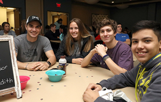A Group of Students Sitting at a Table A Group of Students Sitting at a Table
