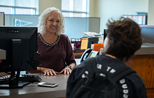Staff Helping Student