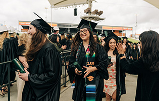 Female Student in a Graduation Cap and Gown Female Student in a Graduation Cap and Gown