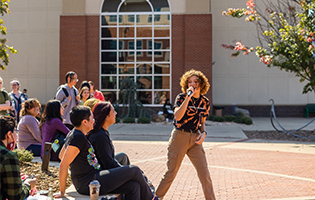 Woman Singing on Microphone Woman Singing on Microphone