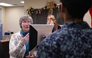 Staff Helping Student