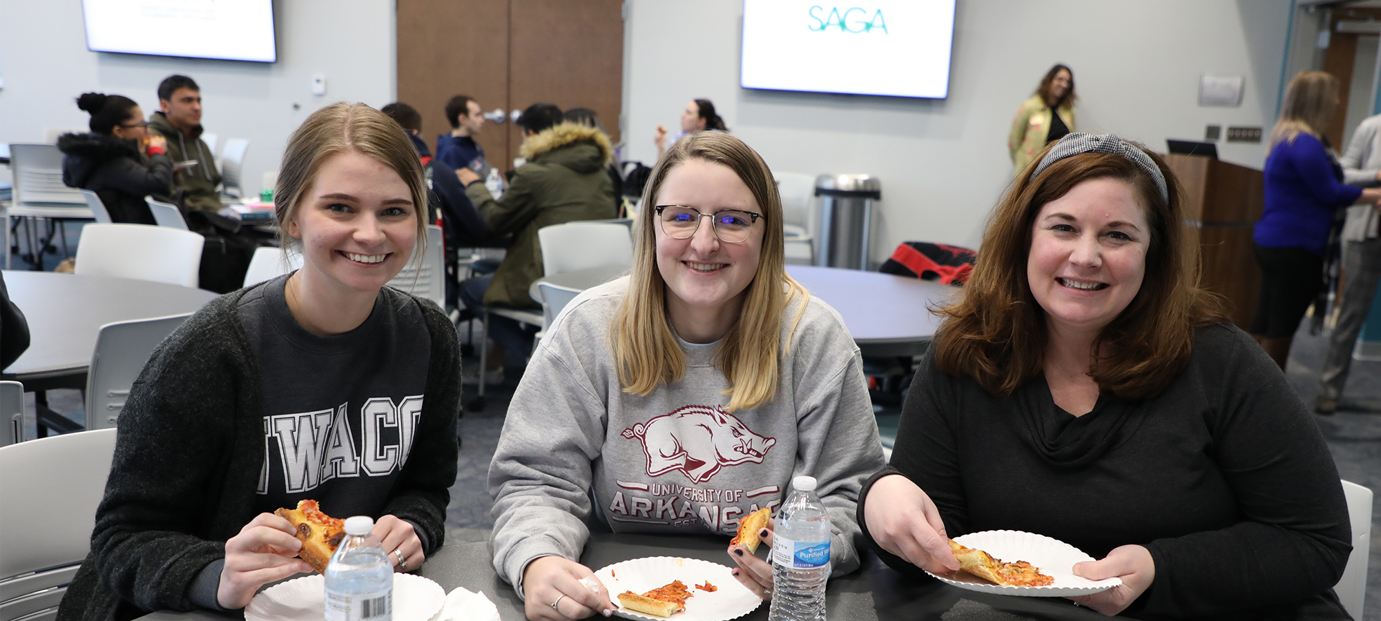 Three Female Students Sitting at a Table Three Female Students Sitting at a Table